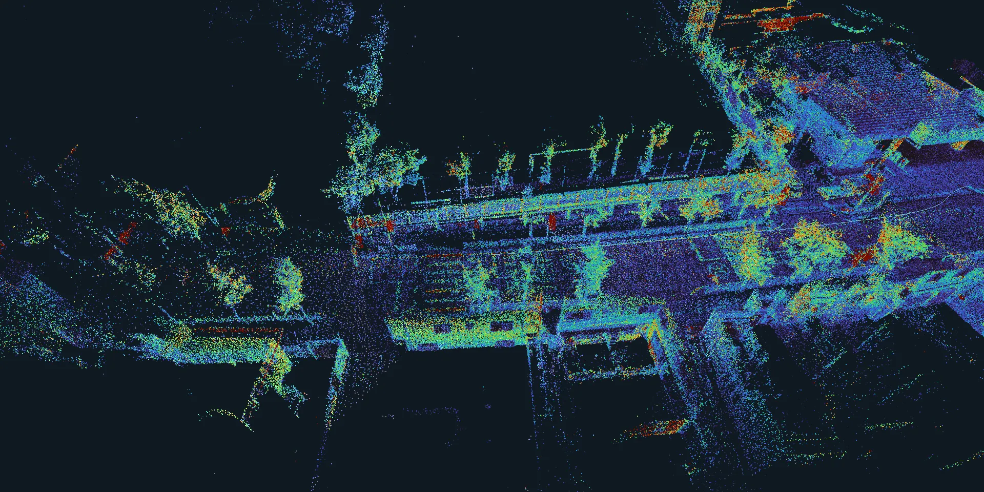 The map of a tree-lined street from HeLiPR town02, coloured by lidar intensity